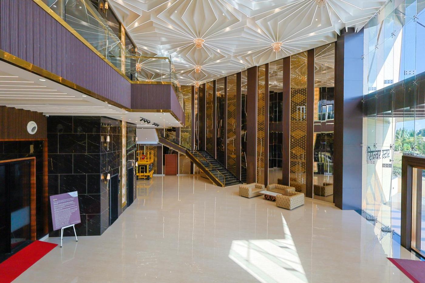 Atrium with grand staircase and starburst ceiling at Silver Star, Amravati